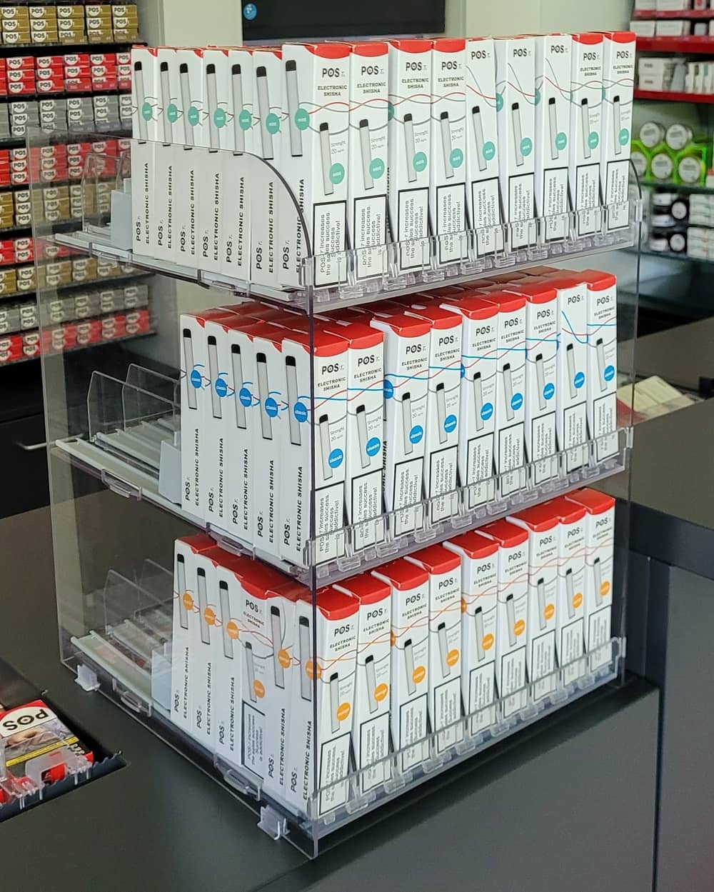 Checkout counter with slim-packaged vape and beauty products showing opportunity for better display